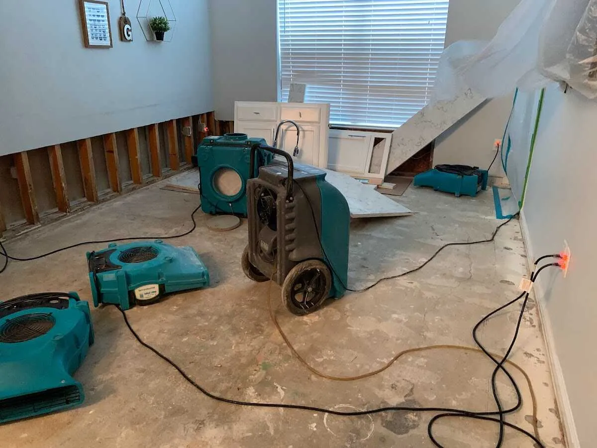 Dehumidifier in flood-cut room for Water Damage Restoration in Estelle